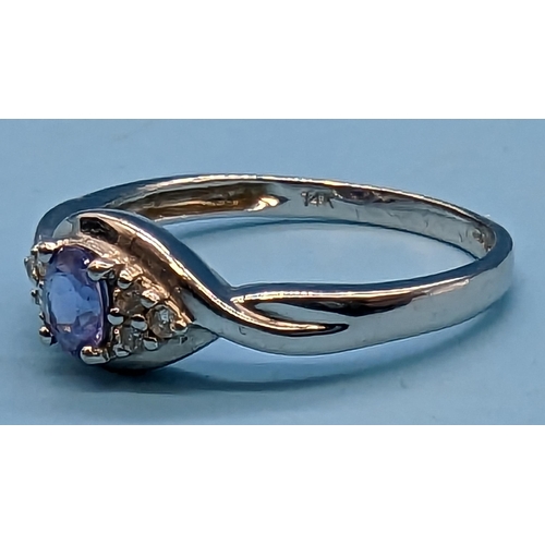 416 - A 14ct  White Gold, Diamond and Tanzanite Ring 3 Grms