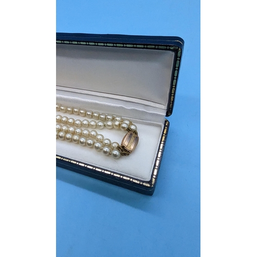 449 - A Cultured Pearl Double Stranded Necklace with 9ct Clasp