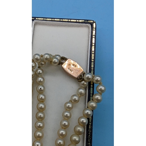 449 - A Cultured Pearl Double Stranded Necklace with 9ct Clasp