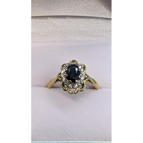 401 - A Hall Marked 18ct Sapphire and Diamond Ring