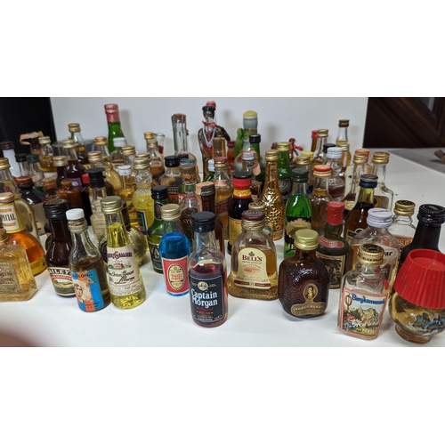 429 - A Large Quantity Of Miniature Spirit & Liqueur Bottles.(Some opened/empty)