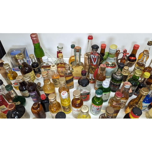 429 - A Large Quantity Of Miniature Spirit & Liqueur Bottles.(Some opened/empty)