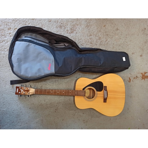 221 - A Yamaha F310 Acoustic Guitar In Padded Case.