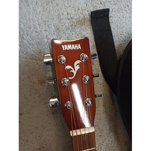 221 - A Yamaha F310 Acoustic Guitar In Padded Case.