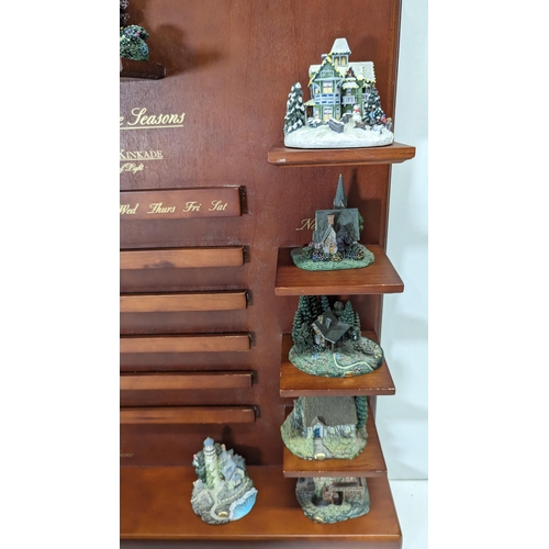 520 - A Thomas Kincaide Hawthorn Village Miniature Cottage Ornament Collection With Calendar Display Stand... 