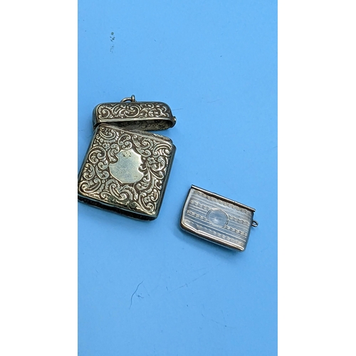 565 - A Silver Novelty Stamp Case and Vesta Case