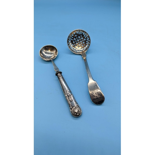 556 - 2 x Hallmarked Silver Strainers. 1 x Solid Silver 1 x Silver Handled.