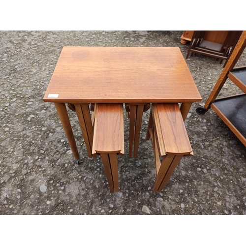 643 - Poul Hundevad Danish Mid Century Nesting Folding Tables.
58cm H x 62cm W x 42cm D