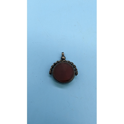 564 - A Bloodstone and Carnelian Rotating Silver Pocket Watch Fob