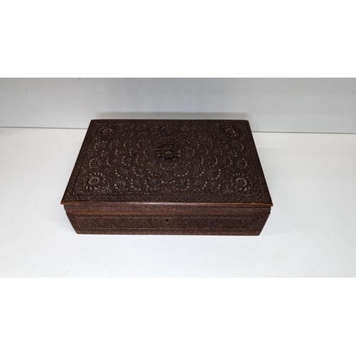 585 - A Carved Wooden Trinket Box.
25cm x 17cm x 7cm