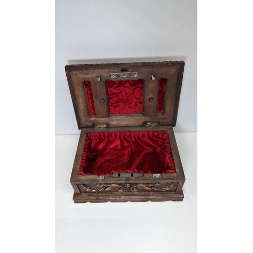 586 - A Carved Jewellery Box Lined In Red Velvet.