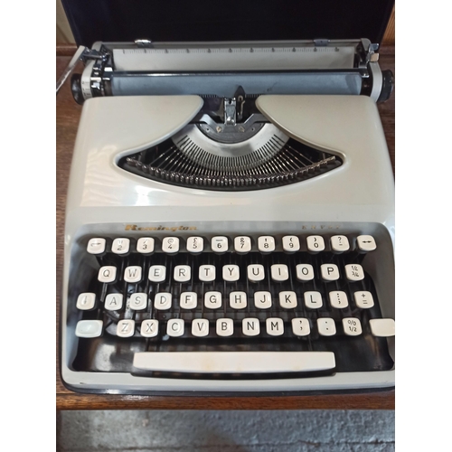 445 - A Remington Envoy Typewriter.