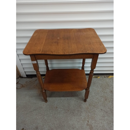 556 - A Vintage Occasional Table With Lower Shelf.
72cm H x 59cm W x 46cm D.