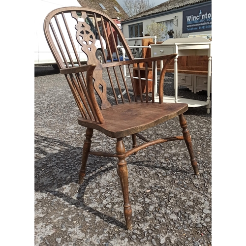 572 - A Antique High Backed Windsor Chair. In Need Of repair To Frame As Pictured.