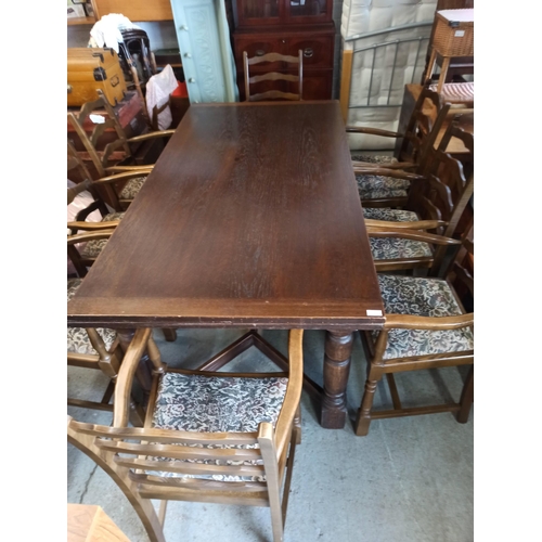 558 - A Large Antique Oak Extending Table With 8 Carver Oak Chairs.
72cm H x 92cm W x 183cm Closed
273cm E... 