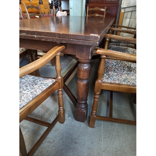 558 - A Large Antique Oak Extending Table With 8 Carver Oak Chairs.
72cm H x 92cm W x 183cm Closed
273cm E... 