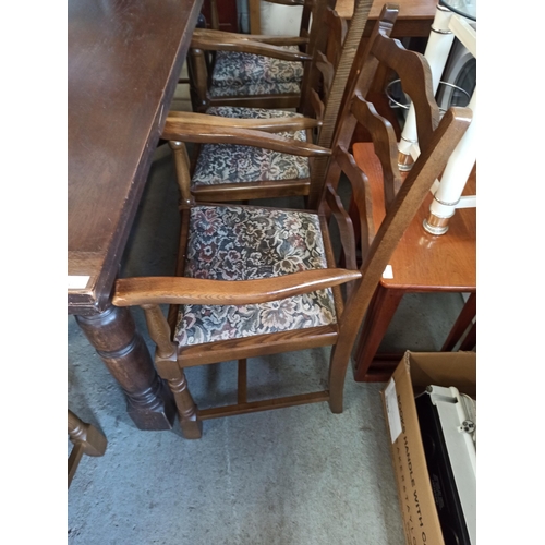 558 - A Large Antique Oak Extending Table With 8 Carver Oak Chairs.
72cm H x 92cm W x 183cm Closed
273cm E... 