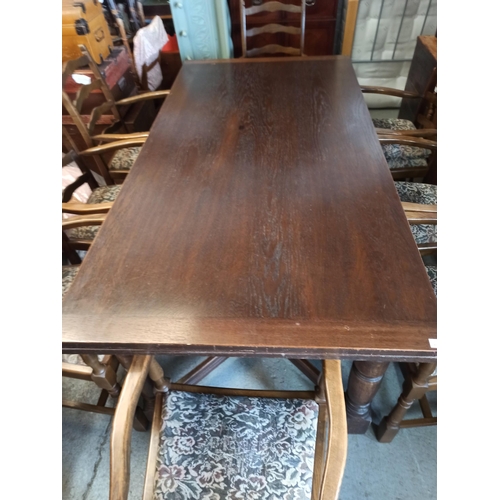 558 - A Large Antique Oak Extending Table With 8 Carver Oak Chairs.
72cm H x 92cm W x 183cm Closed
273cm E... 