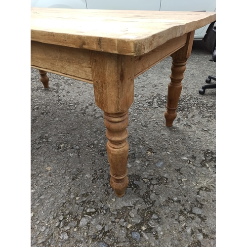 560 - A Antique Pine Kitchen Table, Top Slightly Warped.
77cm H x 186cm L x 90cm W.