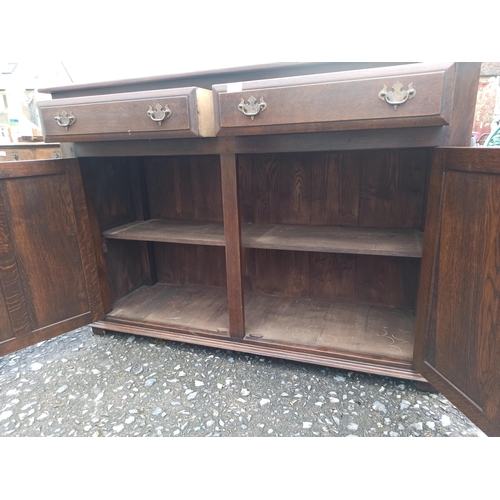 579 - A Antique Mahogany Buffett Sideboard Wit 2 Drawers And 2 Cupboards.
96cm H x 135cm W x 46cm D.