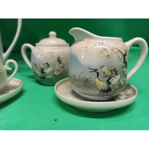 701 - A Vintage Hand Painted Asian Tea Service.
1 x Coffee/Tea Pot, Sugar Bowl, Milk Jug, saucer, With 4 C... 