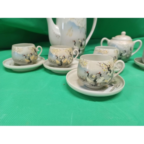 701 - A Vintage Hand Painted Asian Tea Service.
1 x Coffee/Tea Pot, Sugar Bowl, Milk Jug, saucer, With 4 C... 