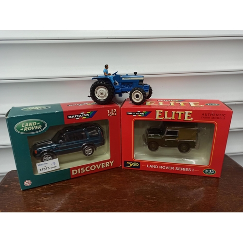 1218 - Britain's Farm Toys Land Rover, Discovery, Land Rover Series 1. Both In Original Packaging. A Ford T... 