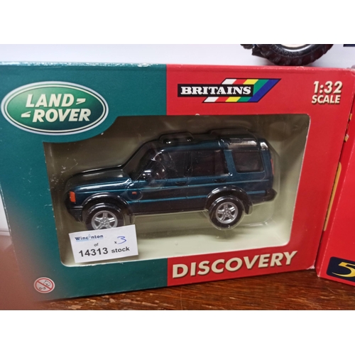 1218 - Britain's Farm Toys Land Rover, Discovery, Land Rover Series 1. Both In Original Packaging. A Ford T... 