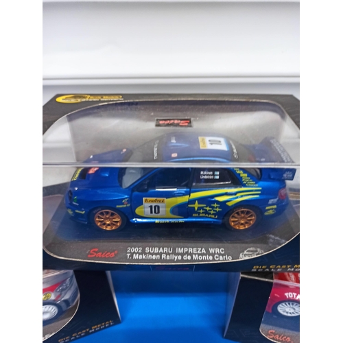 1224 - 3 x Boxed Saico Craftsman series WRC Cars, Including Peugeot 206, Citroen Xsara And Subaru Impreza.