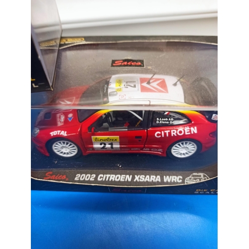 1224 - 3 x Boxed Saico Craftsman series WRC Cars, Including Peugeot 206, Citroen Xsara And Subaru Impreza.