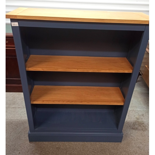 590 - A Blue Painted Book Case With Wood Shelves.
115cm H x 90cm W x 28cm D.