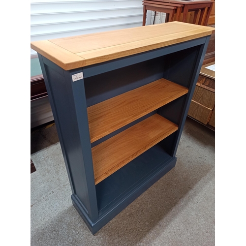 590 - A Blue Painted Book Case With Wood Shelves.
115cm H x 90cm W x 28cm D.