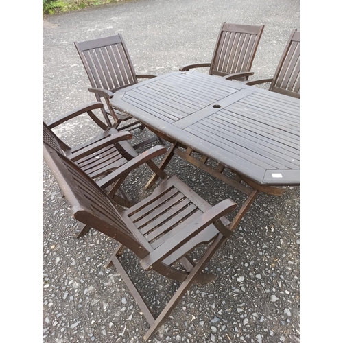 77 - A Wooden Garden Table And 6 x Folding Chairs.