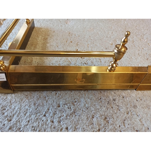 316 - An Extending Brass Fire Surround.
134cm Closed. 175cm x 40cm Open.