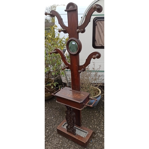 595 - A Wooden Tree Form Hall Coat/Umbrella Stand With Mirror And Drip Tray.
73cm W x 201 cm H.