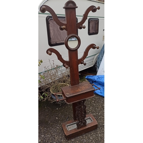 595 - A Wooden Tree Form Hall Coat/Umbrella Stand With Mirror And Drip Tray.
73cm W x 201 cm H.