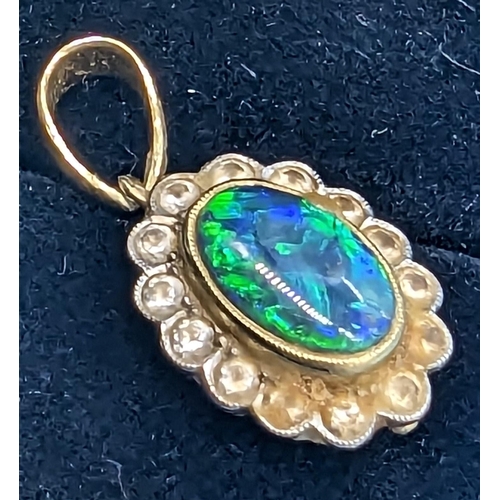 419 - An Unhallmaarked but Tested 9ct Gold Diamond and Opal Pendant 2.93 Grams