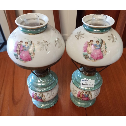 976 - A Pair Of Ceramic Oil Lamps.