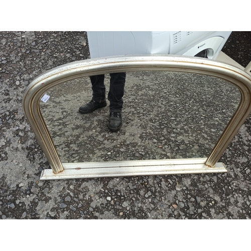 599 - A Curved Top Over Mantle Mirror.
80cm H x 120cm.