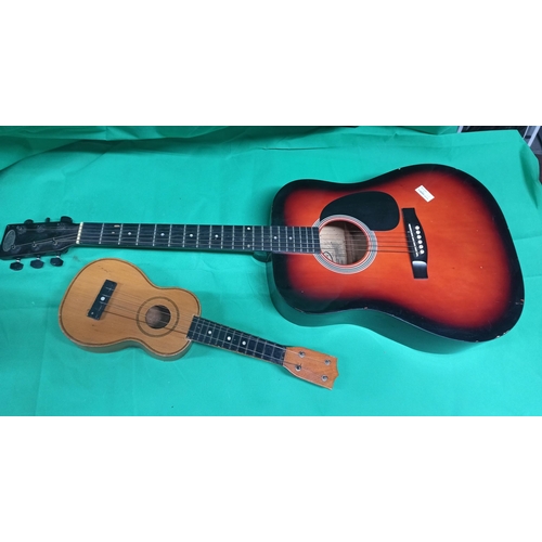 340 - A Ukulele And Guitar, Guitar Made By Stag.