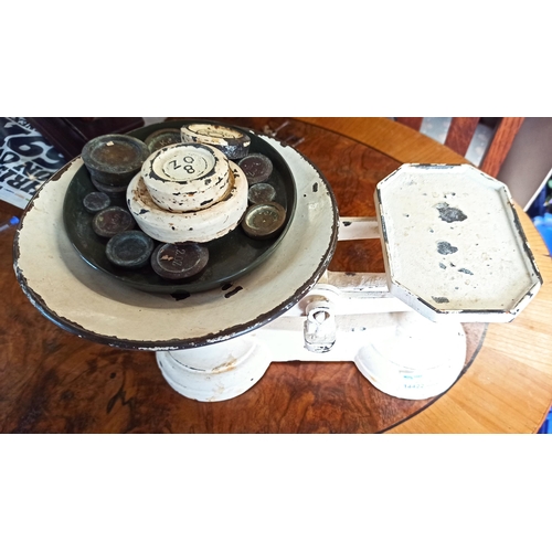 971B - A Set Of White Painted Kitchen Scales With An Assortment Of Weights.