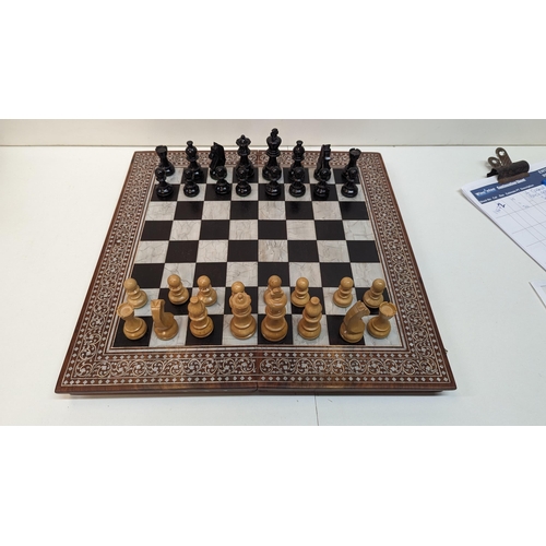 531 - A Chess Set in Inlaid Wooden Board