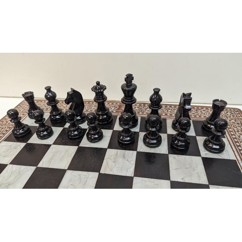 531 - A Chess Set in Inlaid Wooden Board