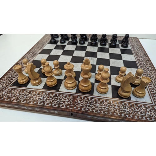 531 - A Chess Set in Inlaid Wooden Board