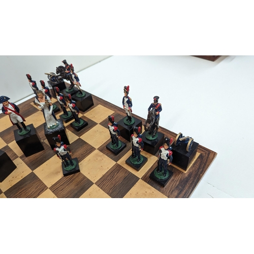 532 - A Napoleonic Chess Set with Hand Painted Metal Pieces an Board 42cm x 42cm