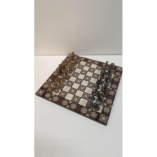 533 - A Damascus Style Chessboard and Metal Pieces 30 x 30cm