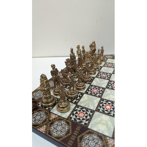 533 - A Damascus Style Chessboard and Metal Pieces 30 x 30cm