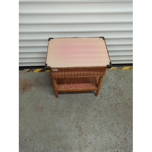 337 - A Vintage Wicker Sewing Table With Lower Shelf And Contents With Glass Top.
50cm H x 45cm W x 30cm.