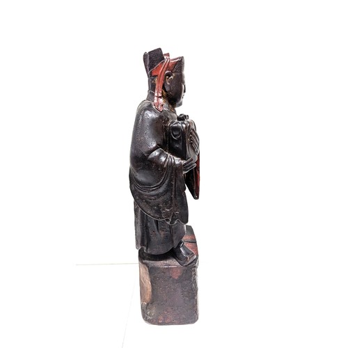 607B - A Chinese Lacquer Wood Carving of a Scholar 64cm Tall