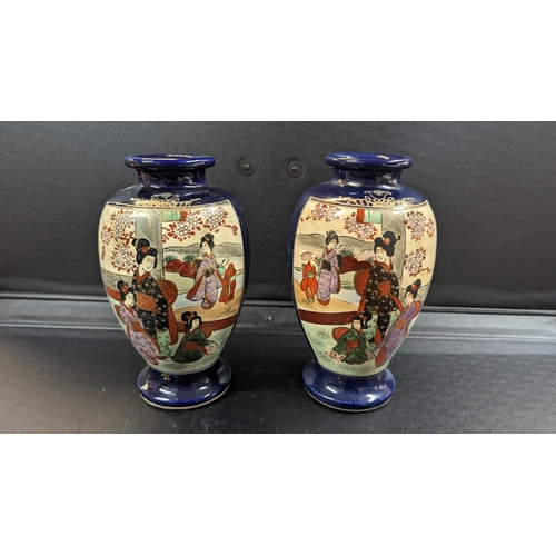 617 - A Pair of Opposing Japanese Geisha Hand Painted Vases